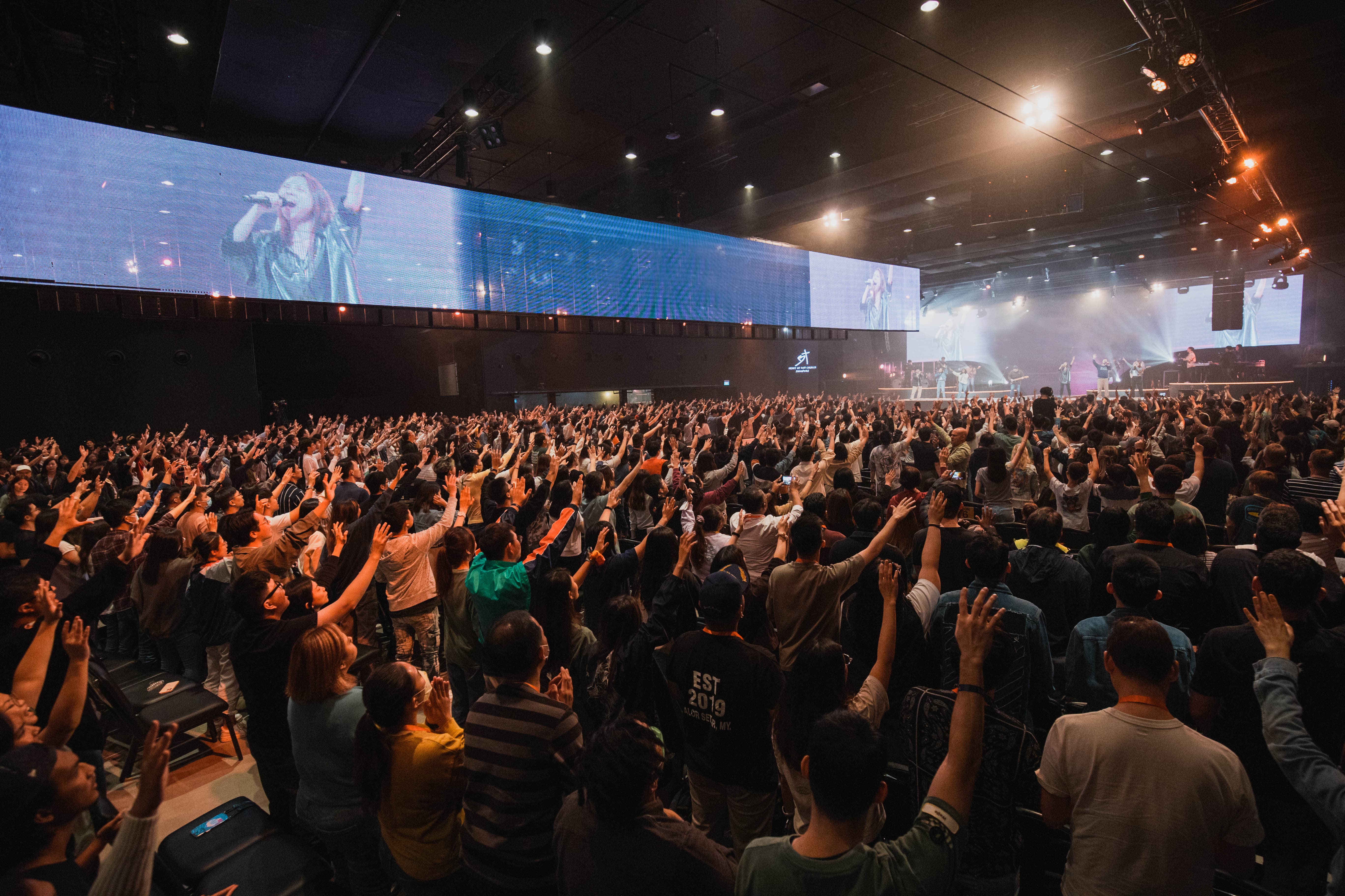 Thousands worshipping in the revival atmosphere at Heart of God Church Singapore